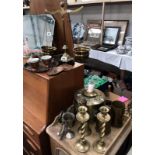 A quantity of brassware including 2 shell cases, pair of candlesticks, scales etc.