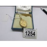 A 9ct gold locket HM G.