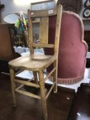 A wooden strut back child's chair