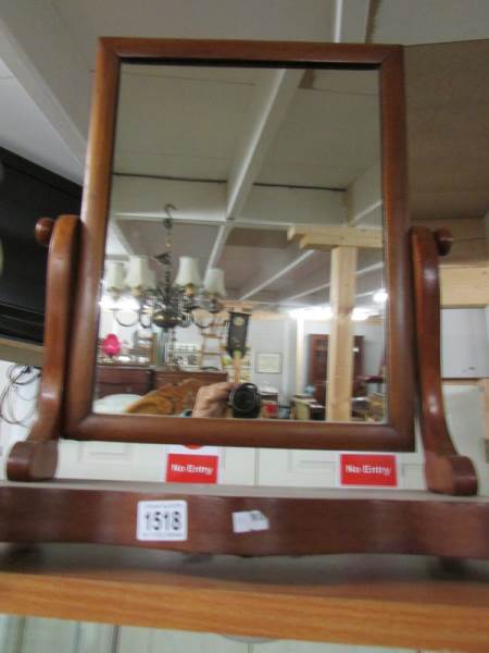 A Victorian mahogany toilet mirror.