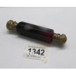 A Victorian ruby glass double ended scent bottle with gilt metal caps, 12cm long.