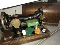 A cased Singer sewing machine