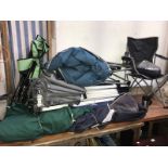 A quantity of camping equipment including folding tents and garden chairs