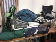 A quantity of camping equipment including folding tents and garden chairs