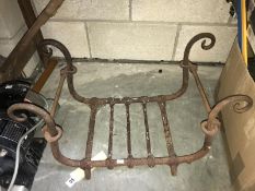 A wrought iron fire grate