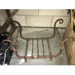 A wrought iron fire grate