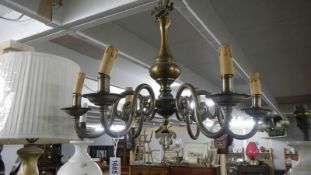 A 6 lamp brass ceiling light.