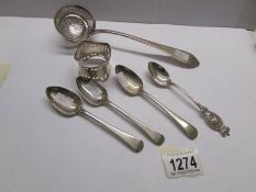 A silver sifter spoon, 4 silver teaspoons and a silver napkin ring.