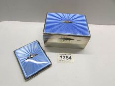 A silver and enamel cigarette case with R.A.