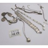 A silver bracelet, a silver cross on chain, a silver locket on chain and 4 white metal items.