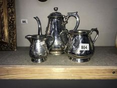 A 3 piece silverplate coffee set consisting of coffee pot (marked Harrison,