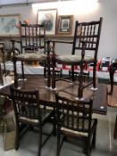 An old extending table and 4 chairs and 2 carvers