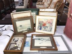 A collection of framed and glazed pictures