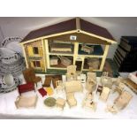 A child's toy doll house with furniture