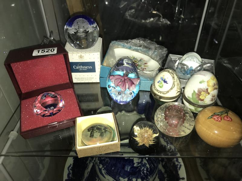 A collection of paperweights, trinket boxes etc.