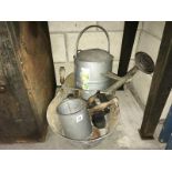 A collection of galvanised steel items including feeding bucket, watering can, measuring jug etc.