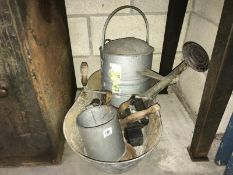A collection of galvanised steel items including feeding bucket, watering can, measuring jug etc.