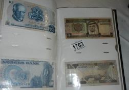 A folder of 107 international bank notes including England, Scotland, Falk Islands (15 June 1982),