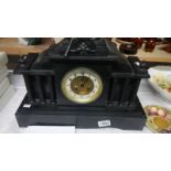 A Victorian black slate Palladian style mantel clock..