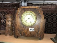 An oak art deco style clock.