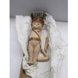 A U.S.A. ww1 'Kewpi' porcelain doll, arms need re-stringing.