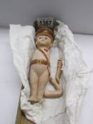 A U.S.A. ww1 'Kewpi' porcelain doll, arms need re-stringing.