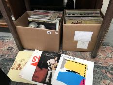 2 boxes of over 100 LP records including double LP's and assorted genres