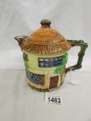 A Beswick cottage teapot.