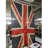 An old Union Jack flag on pole.