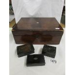 A wooden box and 3 stamp boxes.