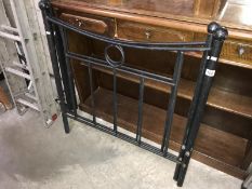 A black metal single bed frame