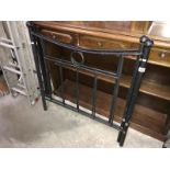 A black metal single bed frame