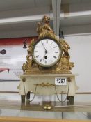 A continental gilt clock surmounted figure.