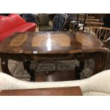 An inlaid table with ecclesiastical picture panels.