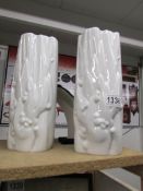 A pair of white Meissen modernist vases, one perfect, one marked with 3 slashes.