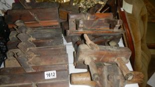 A quantity of old wood working planes.