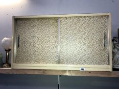 A sliding door wall cabinet