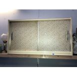 A sliding door wall cabinet