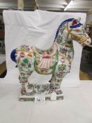 A large oriental hand painted tang horse.