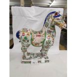 A large oriental hand painted tang horse.