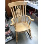 A pine rocking chair