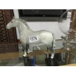 A Beswick dapple grey stallion.