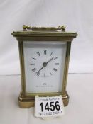 A Matthew Norman carriage clock with key.