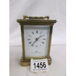 A Matthew Norman carriage clock with key.