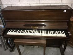 A Colona London piano and piano stool