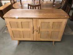 An Ercol light sideboard.