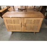 An Ercol light sideboard.