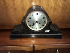 A large oak cased striking mantel clock