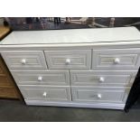 A white bedroom chest of drawers