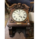 A Victorian oak cased wall clock with chain driven movement featuring presentation plaque